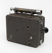 DEVRY: Circa 1926 35mm hand-cranked Devry 'Lunchbox' Standard Portable Camera, with Wollensak Velostigmat f2.8 lens and internally-stored locking lens cap.