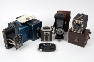KODAK: Group of six cameras comprising one No. 2A Brownie in blue with Kodak leather case and instruction booklet, one Six-20 Brownie with Kodak leather case, one Senior Six-16 in leather case, one Brownie Reflex, one Bullet, and one Jiffy Kodak Six-20. (
