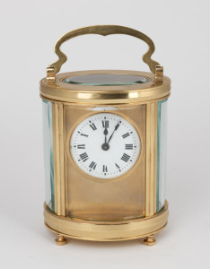 An antique French oval cased time only carriage clock with Roman numeral enamel dial and gilt mask surround, the movement with original silvered lever platform escapement, circa 1900, 15cm high (handle up)