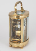 An antique French oval cased time only carriage clock with Roman numeral enamel dial and gilt mask surround, the movement with original silvered lever platform escapement, circa 1900, 15cm high (handle up) - 2