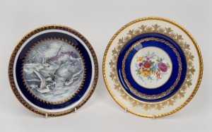 Two blue and gilt English porcelain cabinet plates manufactured by ROYAL WORCESTER and PARAGON, 20th century, ​​​​​​​24cm and 26cm diameter.