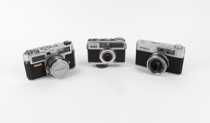 VARIOUS MANUFACTURERS: Group of three cameras - one Taiyodo Koki Beauty LM with Beauty-S F.C. 45mm f1.9 lens and Beauty lens cap, one Konica EE-Matic with Hexanon 42mm f2.8 lens, and one Fuji Optical Fujica Drive with Fujinon 28mm f2.8 lens. (3 items)