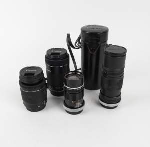 CANON: Group of four lenses - one Canon Zoom EF-S 55-250mm f4-5.6 with Canon front and rear lens caps, one Canon Zoom EF-S 18-55mm f3.5-5.6 with Canon front and rear lens caps, one Canon Lens R 135mm f3.5 with rear lens cap, and one Canon Lens FL 200mm f4