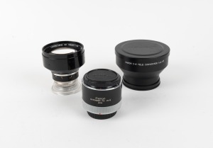 CANON: Group of three lens extensions - one Canon Lens Ex 125mm f3.5 with rear lens cap, one Canon C-8 Tele Converter 1.4x 67 with Canon front and rear lens caps, and one Canon Extender FD 2x-B with Canon front and rear lens caps. (3 items)