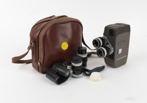 CANON: Canon Cine 8-T 8mm movie camera with two Canon lenses, two Canon lens filters, one Canon C-8 Grip, Canon leather case, and two additional Canon lenses with Canon lens caps, c. 1950s.