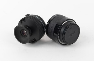 NIPPON KOGAKU: Two lens converters - one Nikon Lens Scope Converter with Nikon cap and Nikon eye cup, together with one Nikon Teleconverter TC-200 2X with Nikon front and rear lens caps. (2 items)