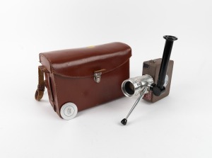 CHRISTEN: Christen Super 8mm movie camera with Som Berthiot Pan-Cinor 10-30mm f2.8 lens [#ZB5381], Som Bethiot lens cap, crank, and leather case, c. 1950s.