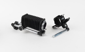 NIPPON KOGAKU: Group of two Nikon F camera accessories in maker's boxes - one bellows and one slide copier. (2 items)
