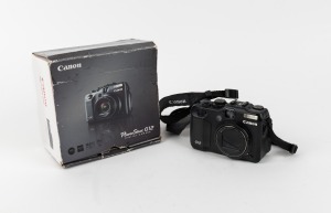 CANON: PowerShot G12 digital camera [#115051000790] with PowerShot strap and maker's box, c. 2010.