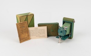 KODAK: Petite 127 film camera, in green with matching leather case, original maker's box, and instruction booklet, c. 1931.