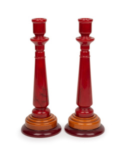 A fine pair of Art Deco red and orange bakelite candlesticks, circa 1920s, 25cm high.