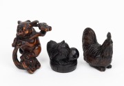 Three Japanese carved boxwood netsuke, 20th century, ​​​​​​​the largest 5cm high.