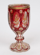 An antique Bohemian ruby overlay faceted goblet with gilt and enamel decoration, circa 1860, 19cm high. - 2