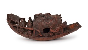An antique Chinese carved bamboo barge ornament, Qing Dynasty, 19th century, 15cm high, 38cm long.