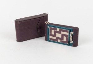 KODAK: 'Step Pattern' Petite 127 film camera, in purple with matching leather case, c. 1931.