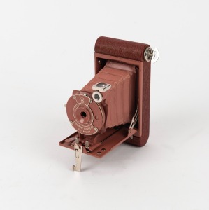 KODAK: Petite 127 film camera, in old rose with original coloured bellows, c. 1931.