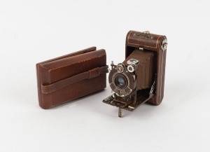 KODAK: Vest Pocket Kodak Series III Vanity 127 film camera, in brown with original bellows, Kodak Anastigmat 83mm f6.3 lens [#33315], and matching satin-lined case, c. 1930.