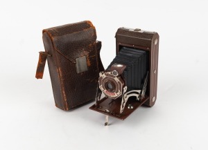 KODAK: Six-20 620 film camera [#40832], in rare brown with enameled metal Art Deco faceplate and matching Kodak leather case, c. 1933.