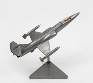 A vintage fighter jet cast aluminium desk ornament, 29cm long overall.