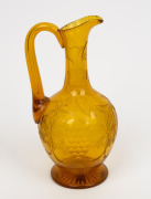 An antique Bohemian citrine glass wine ewer with wheel cut grape decoration, 19th century, 24cm high - 2