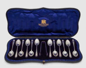 An attractive antique English sterling silver boxed set of twelve teaspoons and sugar tongs, manufactured by George Jackson and George Fullerton of London, circa 1898, the box 34cm wide, 130 grams total silver weight.