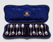 An attractive antique English sterling silver boxed set of twelve teaspoons and sugar tongs, manufactured by George Jackson and George Fullerton of London, circa 1898, the box 34cm wide, 130 grams total silver weight.