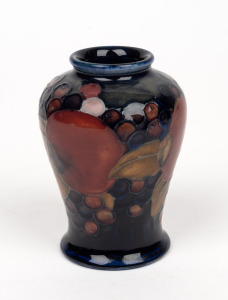 MOORCROFT "Pomegranate" English miniature pottery vase on blue ground, impressed "Moorcroft, Made in England", 9cm high