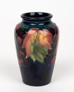 MOORCROFT "Leaves and Berries" English pottery miniature vase on blue and green ground, impressed "Moorcroft, Made in England", 10.5cm high