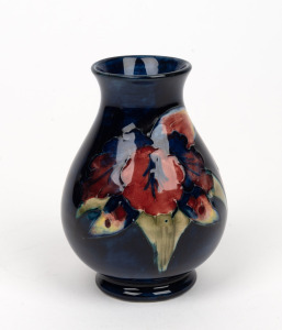 MOORCROFT "Orchid" English pottery miniature baluster shaped vase on blue ground, impressed "Moorcroft, Made in England", 9cm high