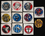 An almost complete set of eleven VFL Team cloth patches, circa late-1950s; all bi-coloured and circular (115mm diameter) printed on square swatches, except the Hawks, which has been cut-to-shape. Lacks only Collingwood. (11).