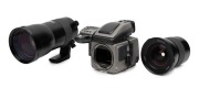 HASSELBLAD: 2011 H4D-40 SLR camera [#DG42038124] with HC 300mm f4.5 [#7JSI10169] and HC 35mm f3.5 lenses [#7ASC12839], front and rear lens caps, two lens filters, two lens hoods, and many additional Hasselblad camera system elements, all organised into st - 9