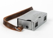 MINOLTA: Konan-16 Automat subminiature camera [#32064], c. 1950, in chrome with Rokkor 25mm f3.5 lens and wrist strap. - 2