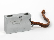 MINOLTA: Konan-16 Automat subminiature camera [#32064], c. 1950, in chrome with Rokkor 25mm f3.5 lens and wrist strap. - 4