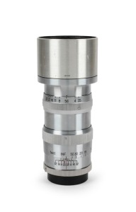 NIPPON KOGAKU: Nikkor-Q&middot;C 135mm f3.5 lens [#262914], c. 1950s, in Exakta mount with metal lens hood and rear lens cap.