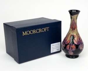 MOORCROFT "Fuchsia Purple Flowers" English pottery vase on dark green and black ground, in original box of issue, circa 1993, impressed factory mark and artist details to base, 17cm high