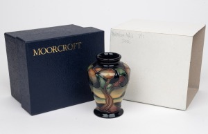 MOORCROFT "Western Isles" English pottery vase on black ground, in original box of issue, circa 2006, factory mark and artist's details to base, 9cm high.