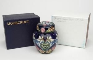 MOORCROFT "Sonama" English pottery ginger jar on purple and black ground, in original box of issue, circa 2002, factory mark and artist's details to base, 11cm high.