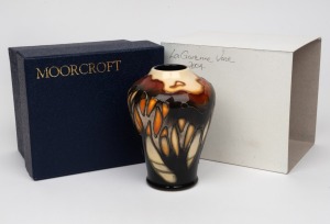 MOORCROFT "Wild Cornflower" English pottery vase on gray ground, in original box of issue, factory mark and artist's details to base, 11cm high.