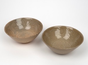 A pair of antique Thai celadon porcelain bowls, ​​​​​​​approximately 8cm high, 18cm diameter each