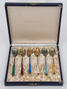 A set of six boxed Danish silver coffee spoons with gilt finished decoration and enamel highlights, 20th century