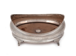 A Georgian sterling silver coaster with engraved floral decoration and wooden insert base, made in London, circa 1803, 11cm high, 20cm wide, 365 grams including wooden base