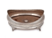 A Georgian sterling silver coaster with engraved floral decoration and wooden insert base, made in London, circa 1803, 11cm high, 20cm wide, 365 grams including wooden base