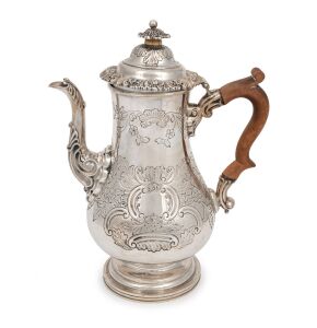 An antique sterling silver pear shaped coffee pot with timber handle, made in Sheffield, circa 1818, 27cm high, 909 grams including handle.