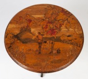 An Australian pokerwork circular occasional table with Medieval landscape scene with figures in castle, circa 1925, 54cm high, 60cm diameter - 2