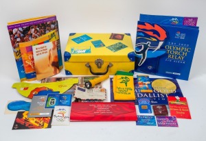 Sydney 2000 Olympics official case containing a large quantity of Olympics memorabilia, including full set of 120 Centennial Olympic Games trading cards, Herald Sun 2000 Olympic Gold Medallist Collection (complete), Sydney 2000 socks and cheerband, Herald