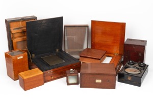 An accumulation of ten early wooden photography items, mostly mahogany, including one camera, one stereo graphoscope, one light box, two enlargement boxes, two glass slide containers, and others. All glass elements intact.