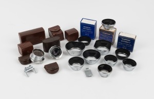 VOIGTL&Auml;NDER: An accumulation of twenty-one items, including leather pouches, two Color-Skopar lenses, lens hoods, and others. (21 items)