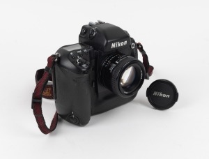 NIPPON KOGAKU: Nikon F5 SLR camera [#3161993] with AF Nikkor D 50mm f1.4 lens, Nikon lens cap, Nikon F5 strap, and instruction booklet, c. 1996.