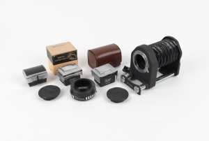 IHAGEE: An accumulation of seven camera accessories, including one bellows, three viewfinder attachments, one lens extender, and others. (7 items)