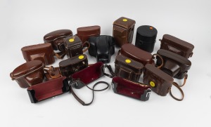 VARIOUS MANUFACTURERS: An accumulation of seventeen leather camera and lens cases, mostly from Nikon. (17 items)